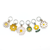 Set of six white, yellow and green enamel daisy charms snag free ring stitch markers with for knitting by Pretty Warm Designs