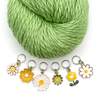 Set of six white, yellow and green enamel daisy charms snag free ring stitch markers with green yarn for knitting by Pretty Warm Designs
