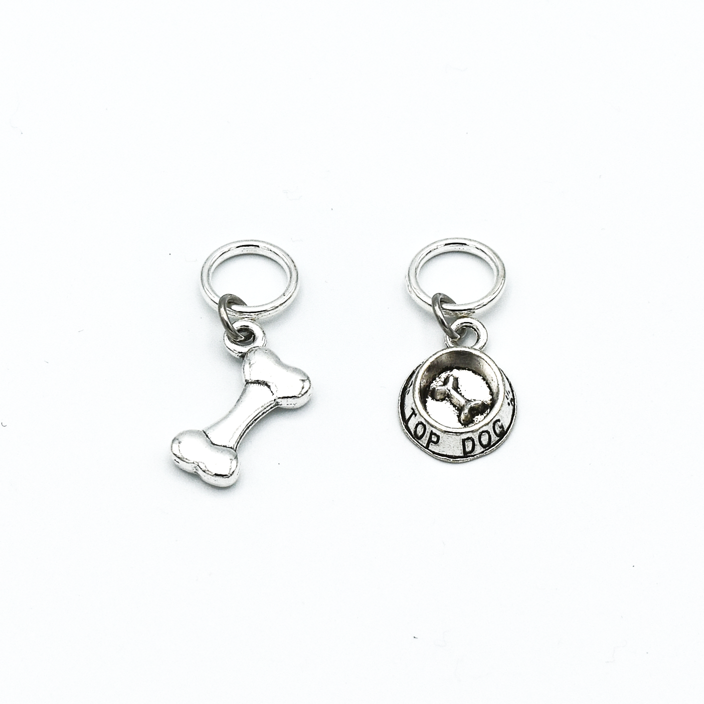 Silver toned dog bone and food bowl charms snag free ring stitch markers for knitting by Pretty Warm Designs Inc.