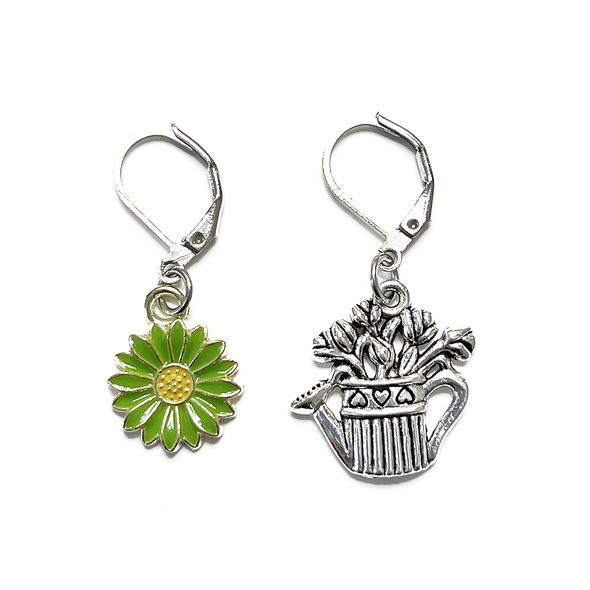 One green and yellow enamel daisy and one antiqued silver alloy watering can holding flowers locking stitch markers for crochet by Pretty Warm Designs Inc