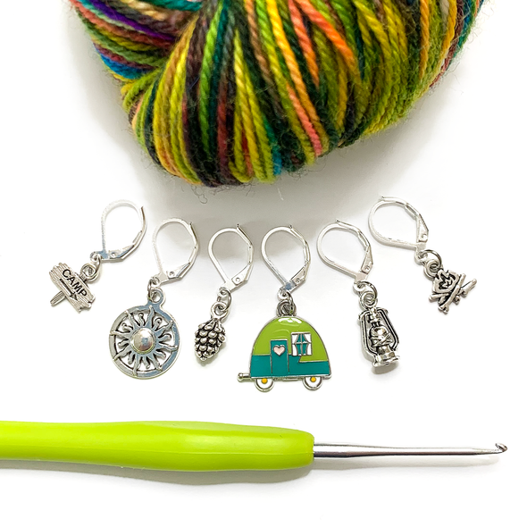Set of one two-toned green and silver enamel tiny camper and five antiqued silver camping themed crochet stitch markers on silver plated lever back clasps with variegated yarn and hook for crochet by Pretty Warm Designs