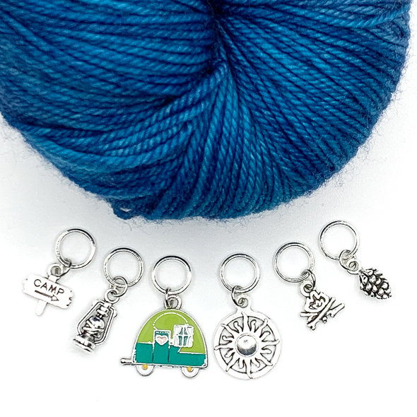 Set of one two-toned green and silver enamel tiny camper and five antiqued silver camping themed stitch markers with blue yarn for knitting by Pretty Warm Designs