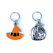 Two Hallowe'en-themed knitting ring stitch markers, one orange and black enamel witch hat and one silver toned jack-o-lantern by Pretty Warm Designs