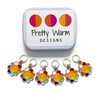 Set of six yellow and rainbow petal enamel happy face flower charms snag free ring stitch markers with decorative tin for knitting and logo by Pretty Warm Designs