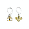 Two bee themed enamel charms locking crochet stitch markers for crochet by Pretty Warm Designs