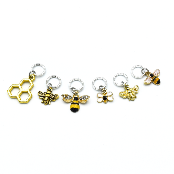 Set of six gold toned bee themed charms snag free ring stitch markers for knitting by Pretty Warm Designs