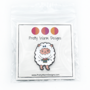 Packaged white and multicoloured enamel on black background sweater knitting sheep brooch pin by Pretty Warm Designs
