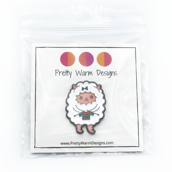 Packaged white and multicoloured enamel on black background sweater knitting sheep brooch pin by Pretty Warm Designs