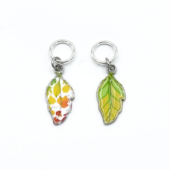 Two multi coloured enamel leaf charms snag free ring stitch markers for knitting by Pretty Warm Designs
