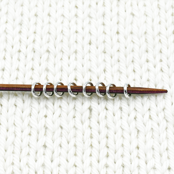 Mini ring stitch markers on needle for knitting by Pretty Warm Designs