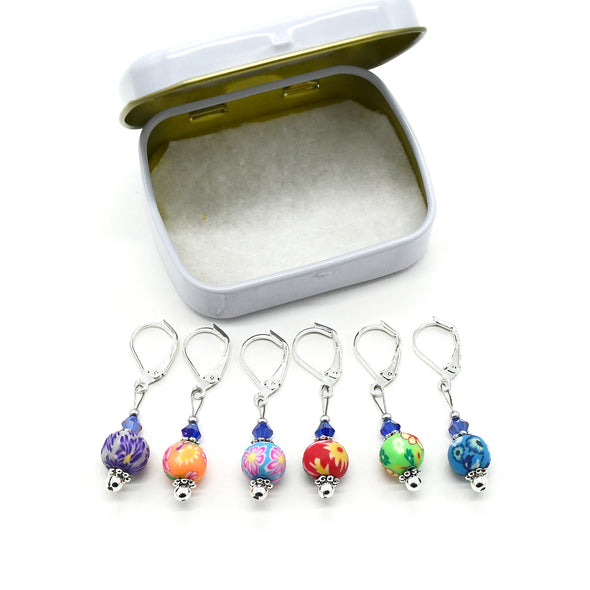 Set of six multi coloured flower beads, blue crystal beads, seed beads and silver plated lever back clasps stitch markers with tin for crochet by Pretty Warm Designs
