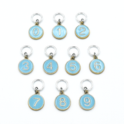 Set of ten blue on gold-toned number charm ring stitch markers for knitting by Pretty Warm Designs