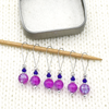 Set of six pink and lavender crackle glass beads, blue bicone crystal beads, perforated silver beads, silver accents on wire stitch markers needle with tin for knitting by Pretty Warm Designs