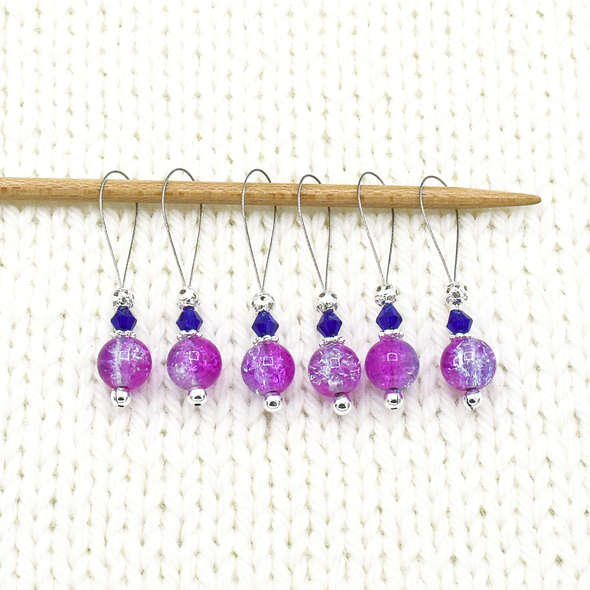 Set of six pink and lavender crackle glass beads, blue bicone crystal beads, perforated silver beads, silver accents on wire stitch markers on needle for knitting by Pretty Warm Designs
