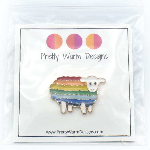 Packaged rainbow striped enamel on metal sheep pin by Pretty Warm Designs