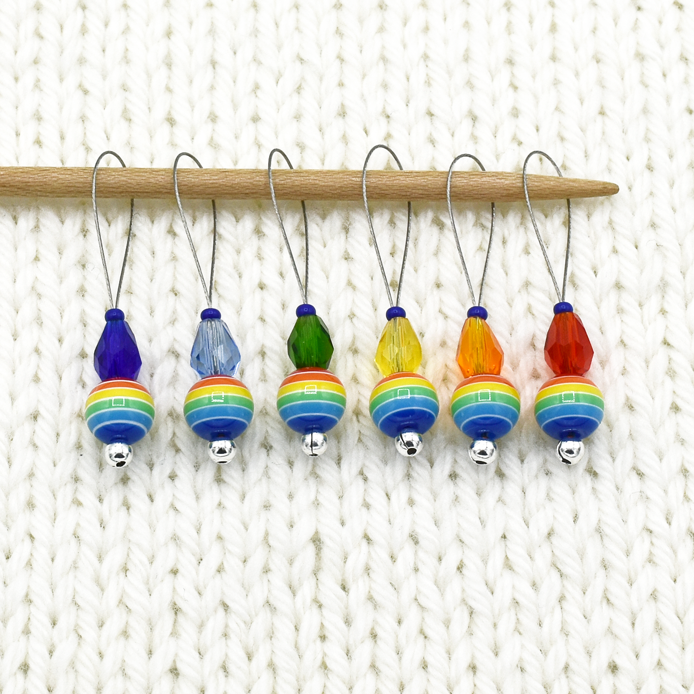 Set of six snag free rainbow glass beads, faceted glass drop beads and blue seed beads on nylon coated wire, stitch markers on needle for knitting by Pretty Warm Designs