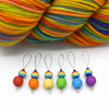 Set of six red, orange, yellow, green, blue and purple snag free silicone beads and rainbow glass beads on nylon coated wire, stitch markers with rainbow variegated yarn for knitting by Pretty Warm Designs