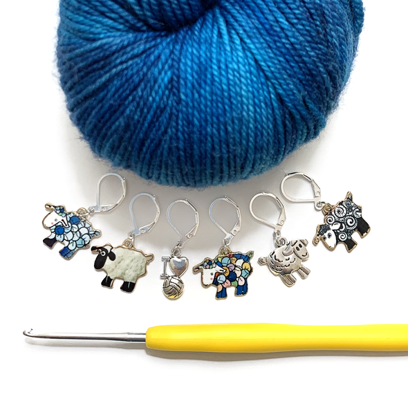 Set of five sheep charm and one yarn charm locking stitch markers with blue yarn and hook for crochet by Pretty Warm Designs Inc.