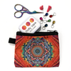 Small multicoloured mandala screen printed fabric zipper pouch with stork embroidery scissors, stitch markers for knitting and knitting needle point protectors sold by Pretty Warm Designs Inc.