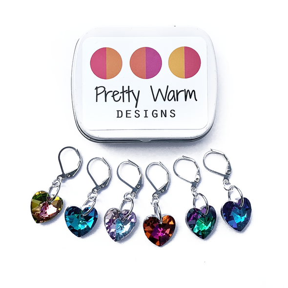 Set of six faceted cut glass multicoloured heart charms locking crochet stitch markers with decorative tin with logo by Pretty Warm Designs Inc.