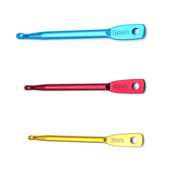 Set of three aluminum crochet hook stitch fixers in sizes 3mm in gold, 4mm in red and 5mm in turquoise for knitting by Pretty Warm Designs
