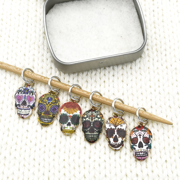 Set of six enamel sugar skull charms snag free ring stitch markers on knitting needle with tin by Pretty Warm Designs