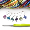 Six colour coated stainless steel round tree of life charm locking stitch markers for crochet with green handled crochet hook and multicoloured variegated yarn by Pretty Warm Designs Inc