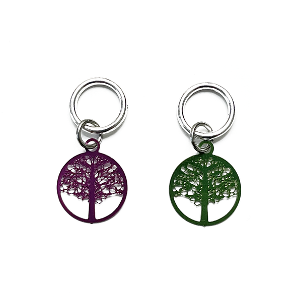 Two fuchsia and green colour coated stainless steel round charm snag free knitting stitch markers by Pretty Warm Designs Inc