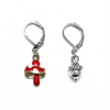 One red and white enamel toadstool crochet stitch markers and one antiqued silver acorn crochet stitch marker made and sold by Pretty Warm Designs Inc