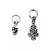 Antiqued silver pine cone and Christmas tree stitch markers for knitting sold by Pretty Warm Designs Inc.