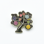 Multicoloured enamel on gold metal yarn tree pin for knitting project bags by Pretty Warm Designs